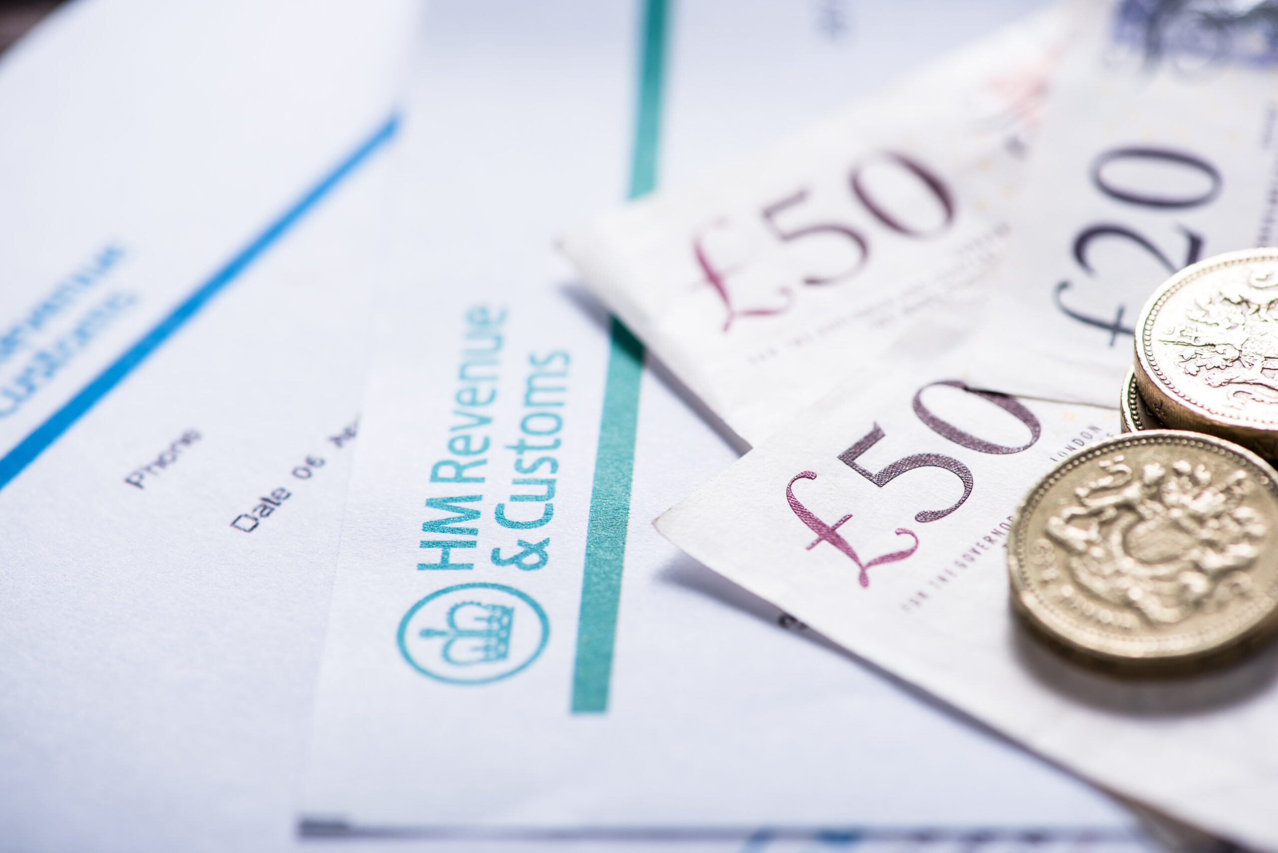 Paying taxes in Uk, notes and sterling coins a close up of some paper money